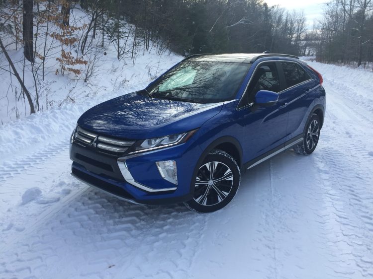 Our reviewer says the coupe-like lines of the Eclipse Cross compromise the height of the rear cargo hold, however, rear seat passengers have ample room for two, even with dual sunroofs overhead adding extra ambient light. 