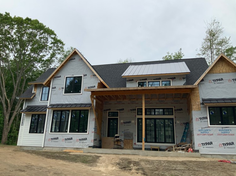 A spec home nearing completion on Shore Rd. in Cape Elizabeth, developed by GenX and sold for $1.7 million. It is one of more than 15 properties that GenX has under construction throughout Greater Portland.