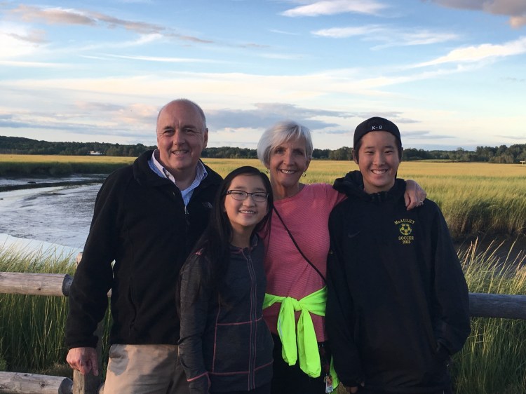 Tom and Julia Ranello pose for a photo with their children Mia and Emma during a 5K run they sponsored to support the Scarborough Marsh.