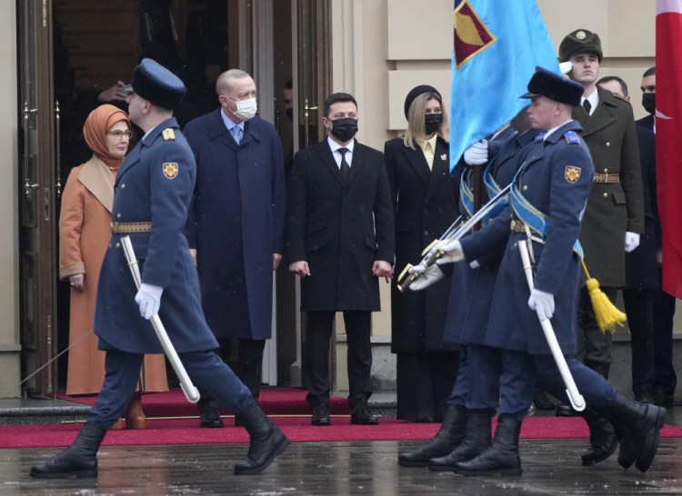 Ukrainian President Volodymyr Zelenskyy, center; his wife, Olena, center right; Turkey's President Recep Tayyip Erdogan, center left; accompanied by his wife Emine, left, review the honor guard during a welcome ceremony ahead of their meeting in Kyiv, Ukraine, on Thursday. 