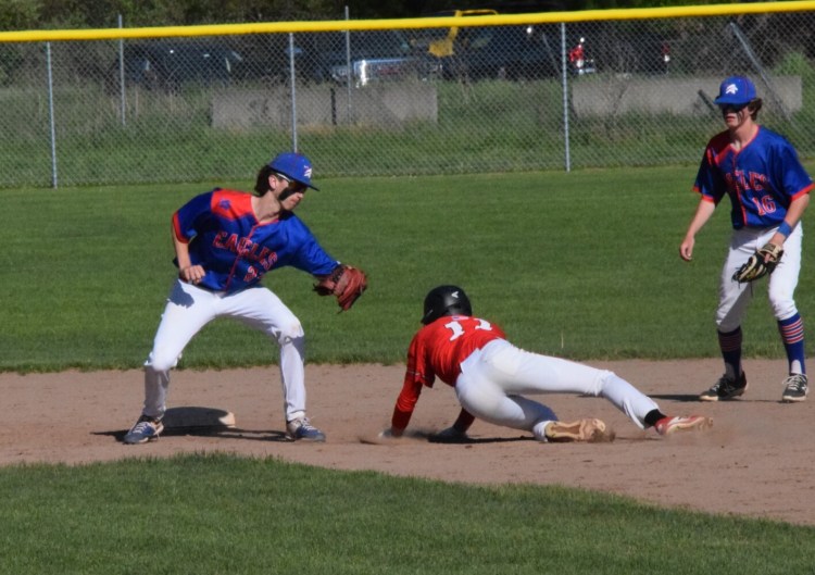 Mt. Ararat freshman shortstop Andrew Clemons, left, prepares to apply the tag on Camden Hills base runner Owen Berez for the third out in the first inning of a game Wednesday in Topsham.

