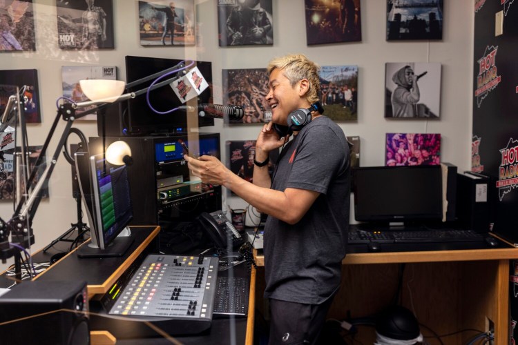  Jon Hawkins - known as DJ Jon - records at the Hot 104.7 FM studio in Scarborough. He's been trying to spread K-pop - Korean pop music - across Maine the last few years at events and on the radio.