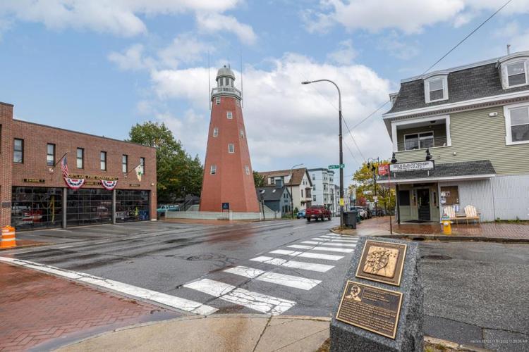 A view from the corner of North and Congress Streets, showing Portland Fire Station #1, the Observatory, a Portland Freedom Trail marker, and Unit 1 above the Hilltop Superette.